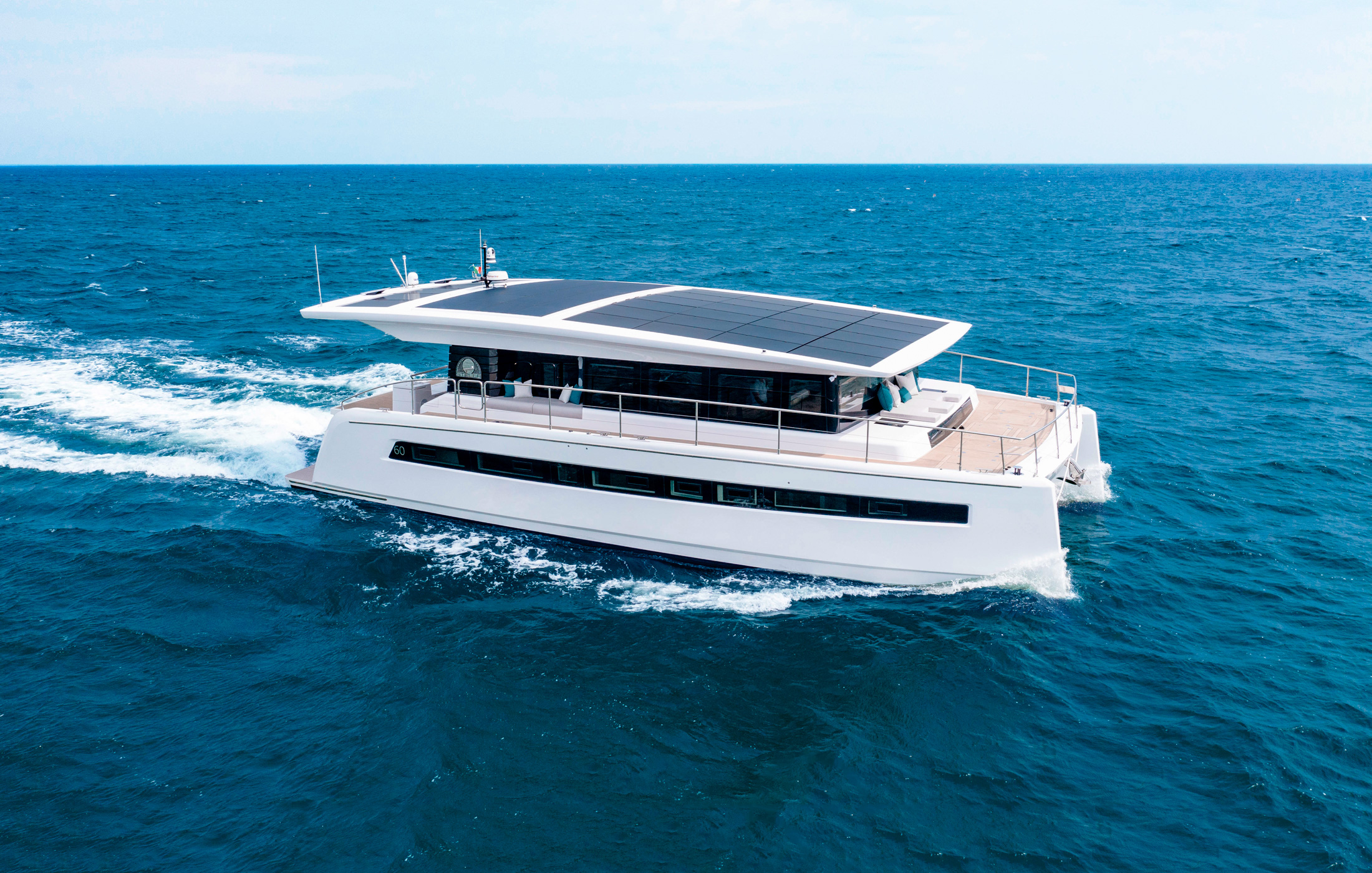 Solar-paneled yacht navigating the seas using solar energy