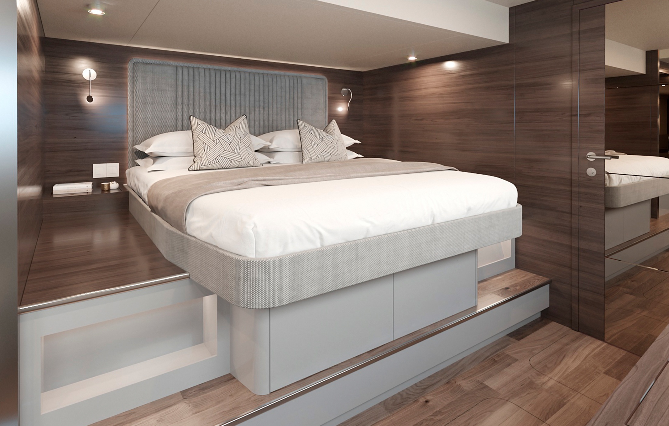 Yachts luxurious owner's cabin with extra large double bed in brown tones